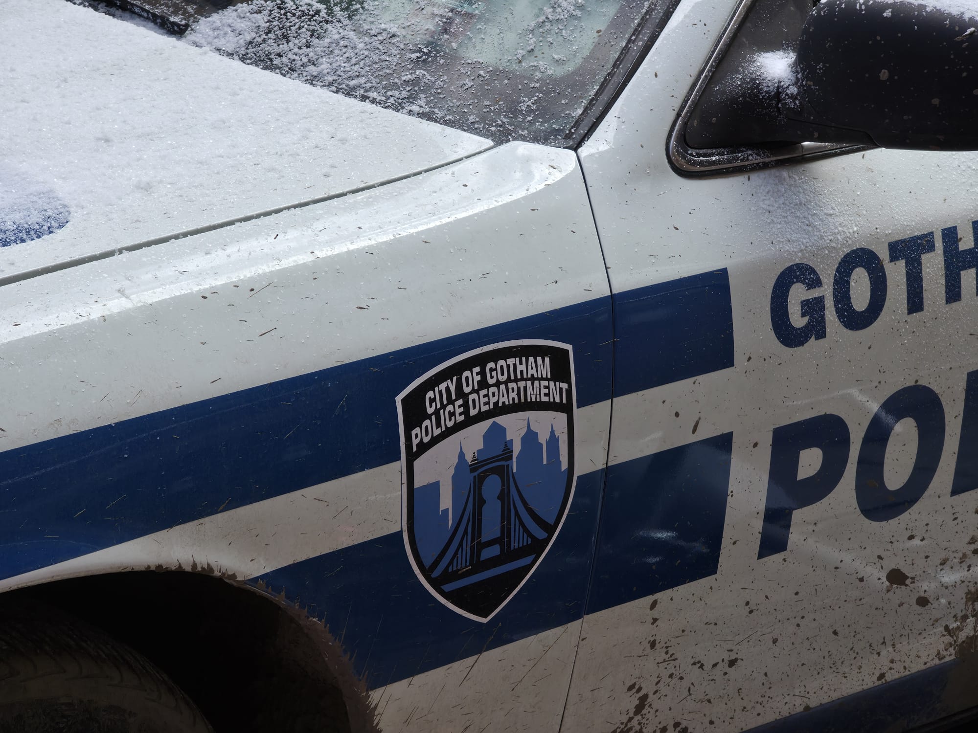 City of Gotham Police Department badge on a Gotham police vehicle