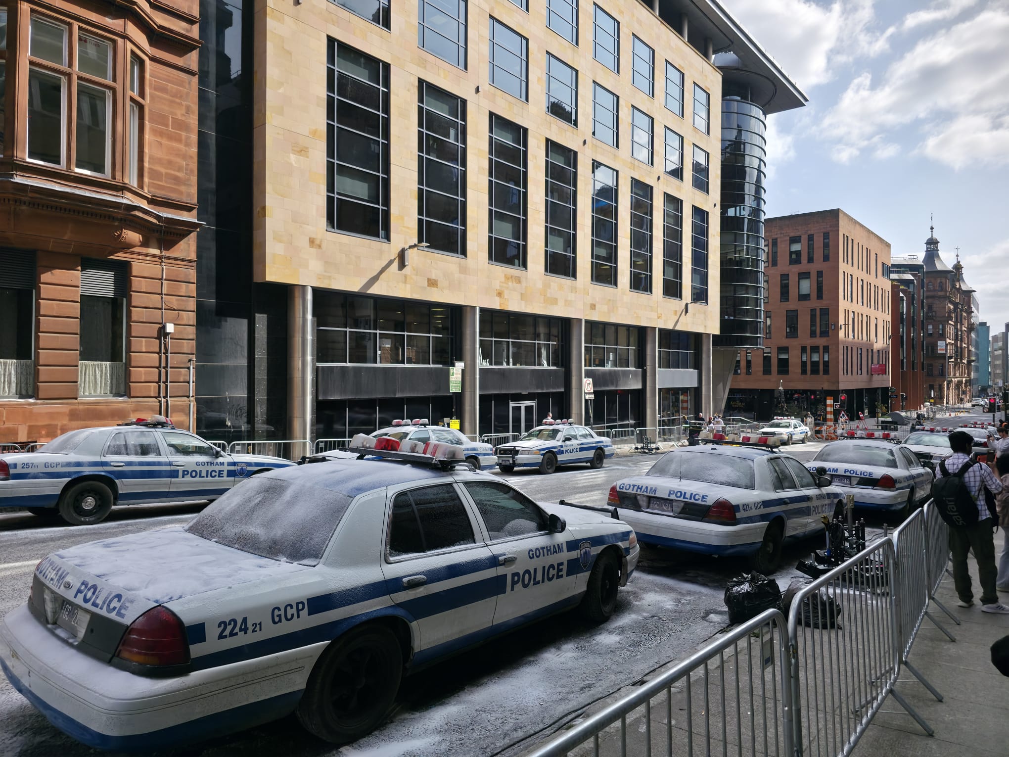 Multiple Gotham City Police vehicles along a Glasgow street